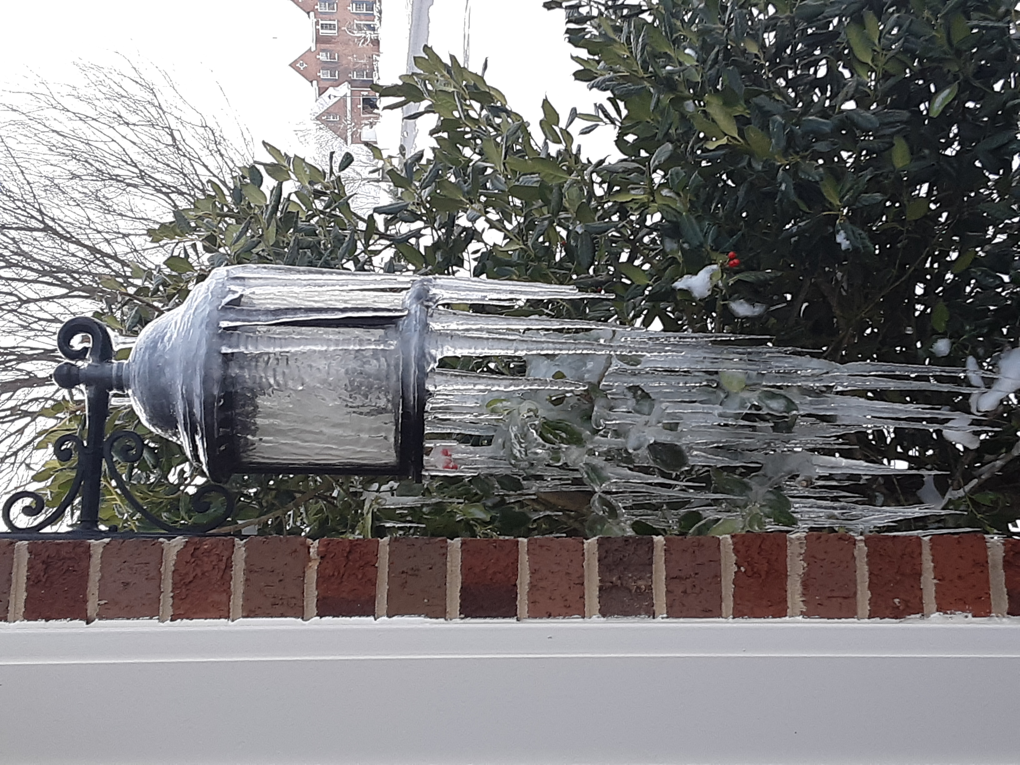 Icicles on Light Fixture and Holly